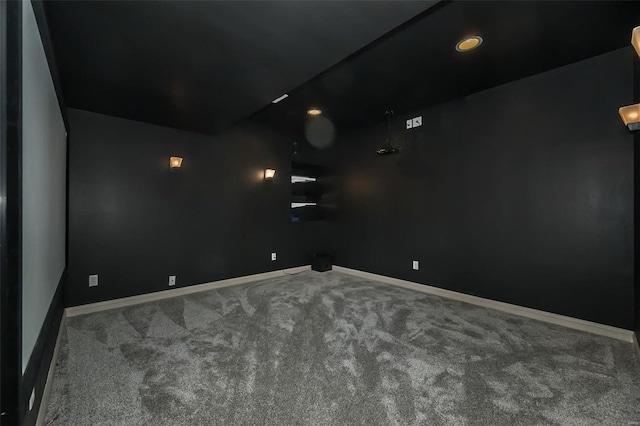 home theater with carpet flooring and baseboards