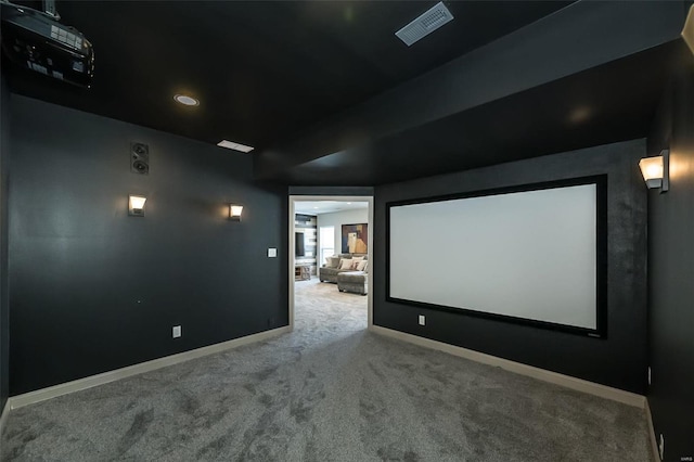 home theater room with carpet, visible vents, and baseboards