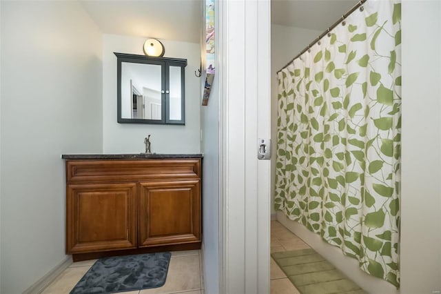 bathroom with tile patterned flooring and vanity