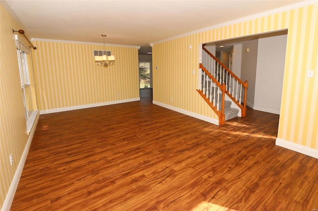 interior space with stairway, wood finished floors, baseboards, wallpapered walls, and ornamental molding