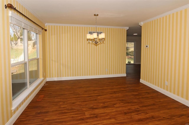 unfurnished dining area featuring wallpapered walls, crown molding, dark wood finished floors, and baseboards