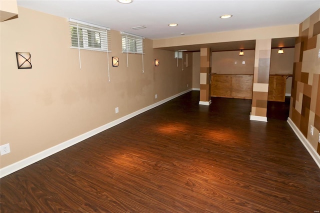 below grade area with recessed lighting, baseboards, and wood finished floors