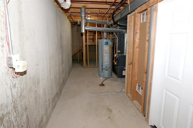 unfinished below grade area featuring gas water heater