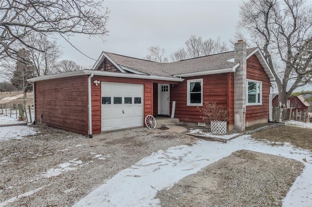 ranch-style home with a garage