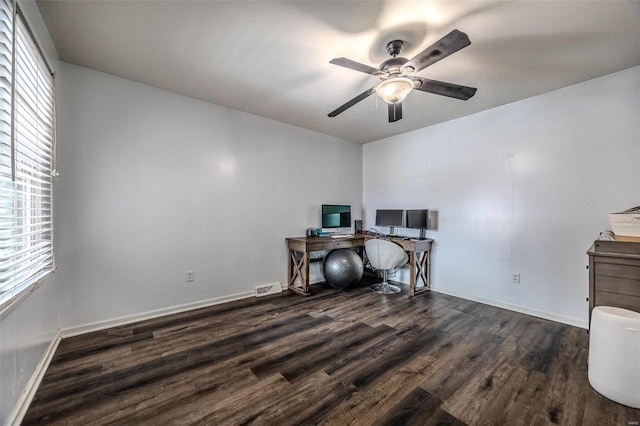 office with ceiling fan, dark hardwood / wood-style floors, and a wealth of natural light