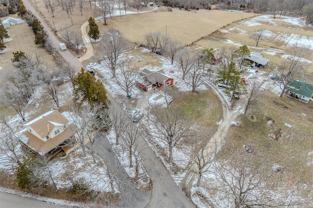 snowy aerial view featuring a rural view