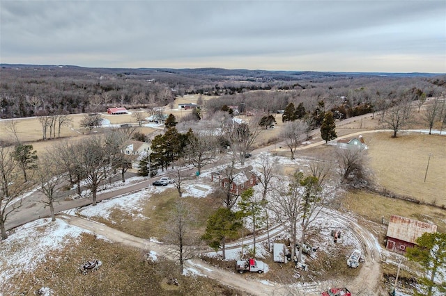 snowy aerial view featuring a rural view