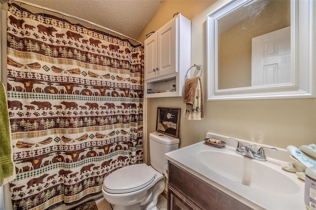 bathroom featuring walk in shower, vanity, toilet, and a textured ceiling