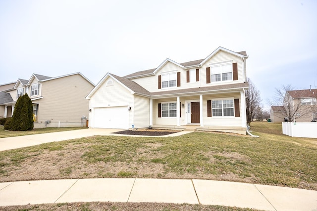 traditional home with concrete driveway, fence, and a front yard