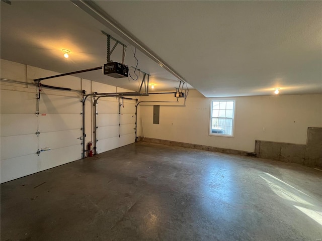 garage featuring a garage door opener and electric panel