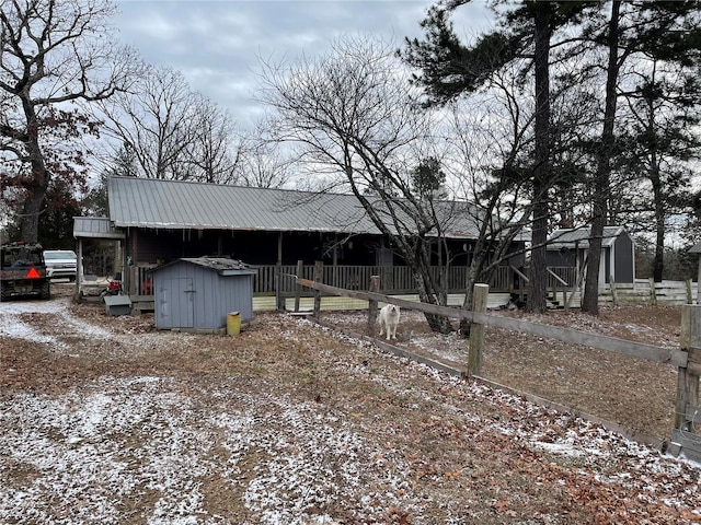 view of front of house with a shed