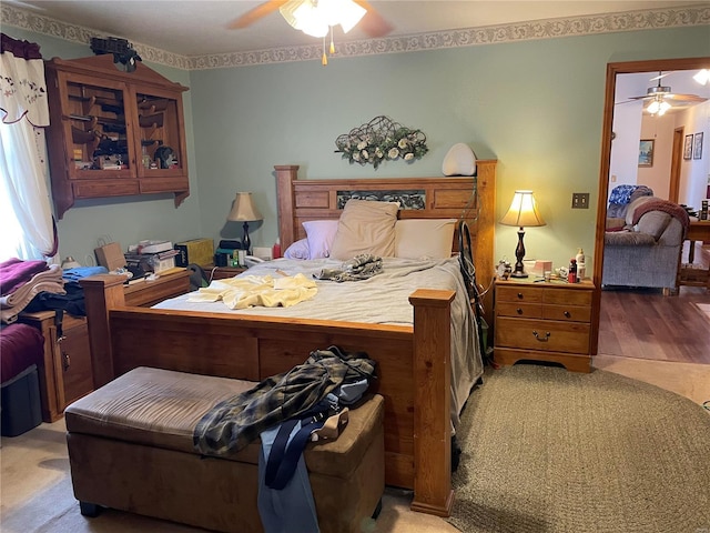 bedroom with hardwood / wood-style floors and ceiling fan