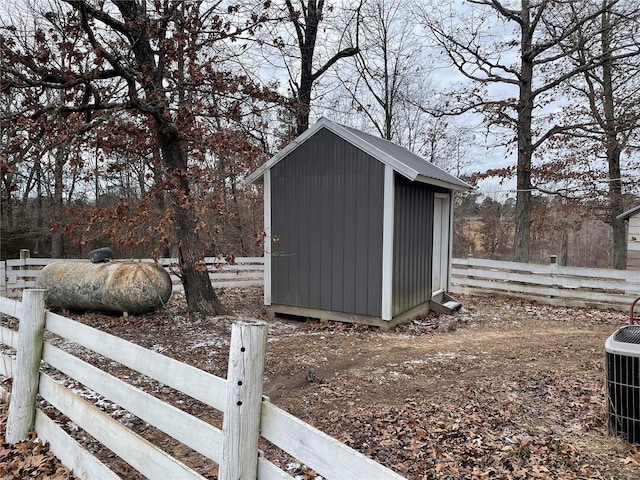 view of outdoor structure featuring central air condition unit