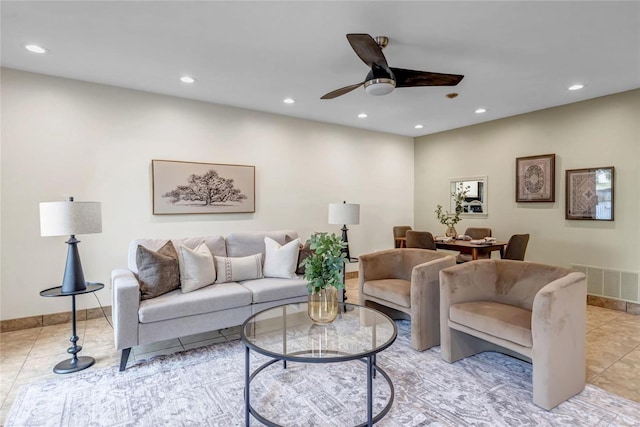 living room featuring light tile patterned floors, ceiling fan, visible vents, and recessed lighting