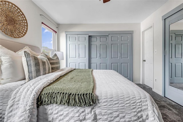 bedroom featuring baseboards, carpet, a ceiling fan, and a closet