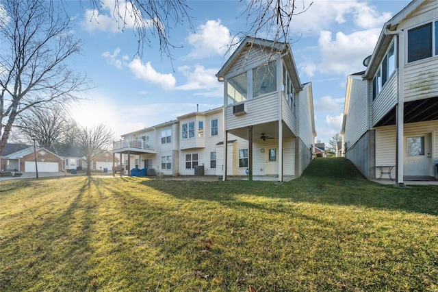 rear view of house with a residential view, a patio, a lawn, and ceiling fan