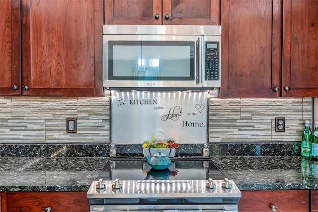 kitchen with backsplash and dark stone counters