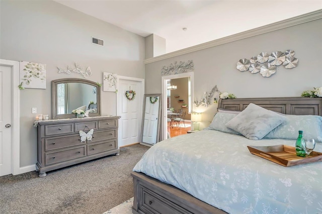 bedroom with light carpet and high vaulted ceiling