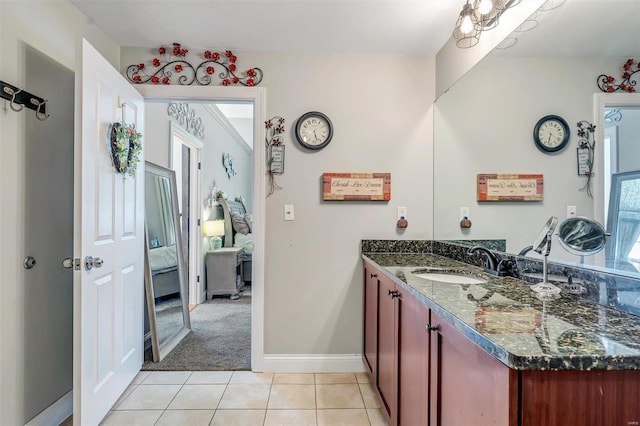 bathroom featuring tile patterned flooring and vanity