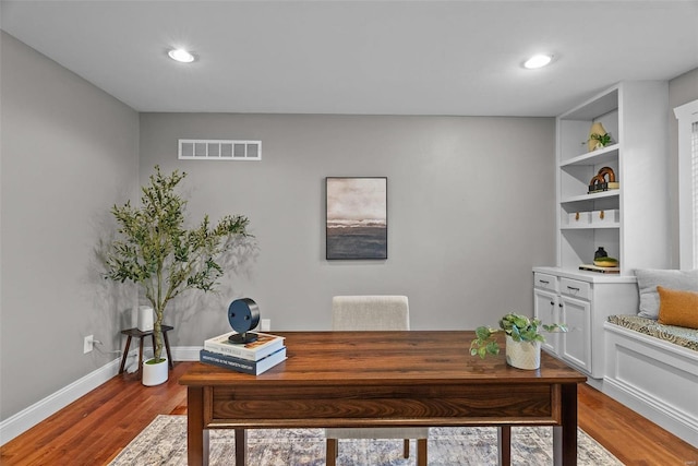 office featuring recessed lighting, wood finished floors, visible vents, and baseboards