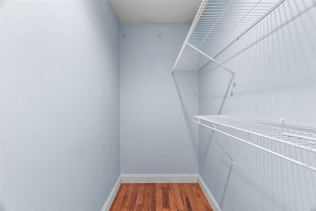 spacious closet with wood finished floors