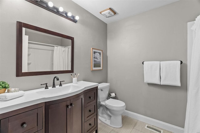 bathroom featuring vanity, baseboards, visible vents, curtained shower, and toilet