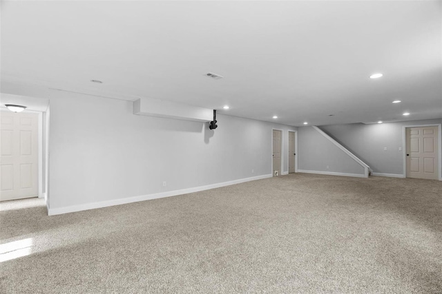 finished below grade area featuring recessed lighting, baseboards, and carpet