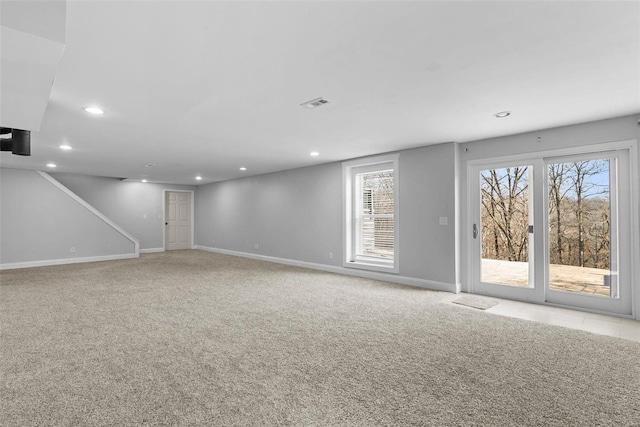 interior space featuring recessed lighting, carpet, and baseboards