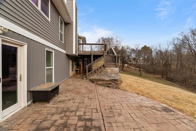 view of patio / terrace featuring stairway and a wooden deck