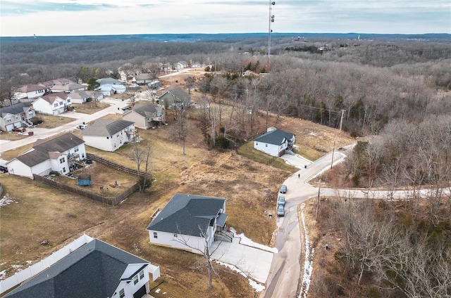 birds eye view of property with a residential view