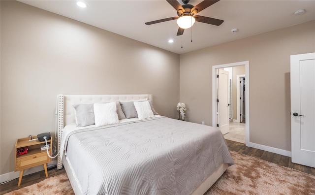 bedroom with a ceiling fan, recessed lighting, baseboards, and wood finished floors