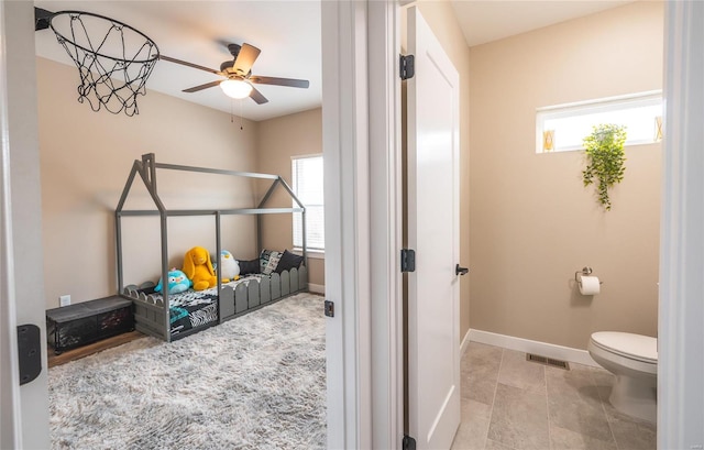 bedroom with visible vents and baseboards