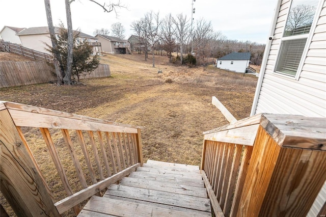 view of yard featuring fence and a wooden deck