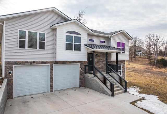 view of front of property featuring a porch, stone siding, an attached garage, and concrete driveway