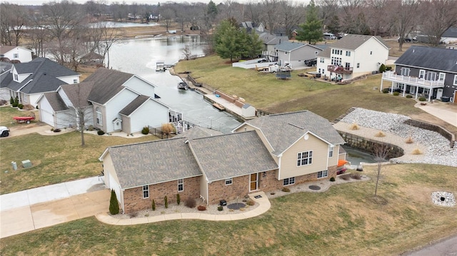 bird's eye view with a residential view and a water view