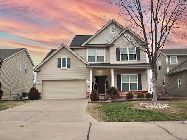 craftsman-style house with a garage and a yard