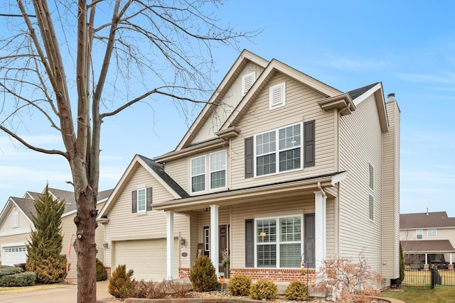 view of front of house with covered porch and a garage