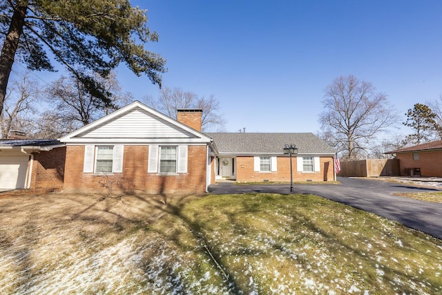 ranch-style house with a front lawn