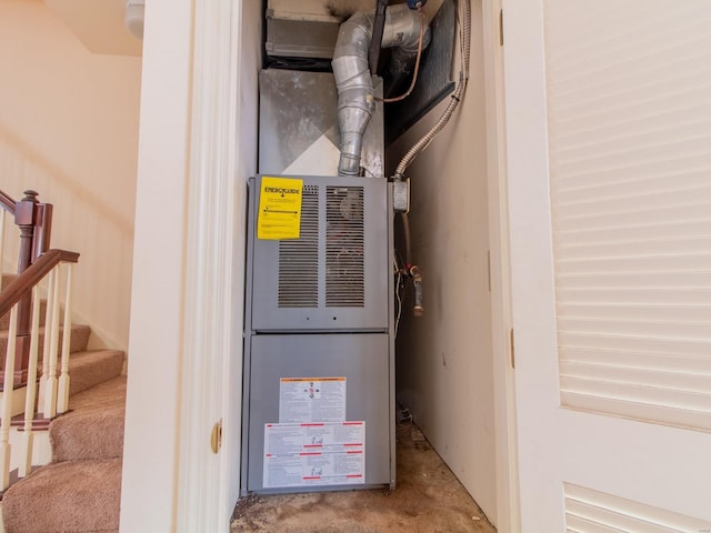 utility room featuring heating unit