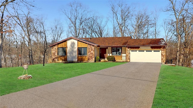 view of front of property featuring a garage, stone siding, concrete driveway, and a front yard