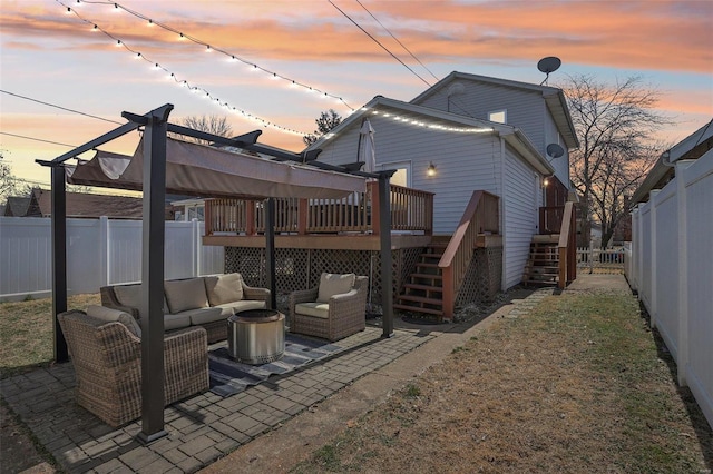 back of property with an outdoor living space, stairs, a deck, a fenced backyard, and a patio area