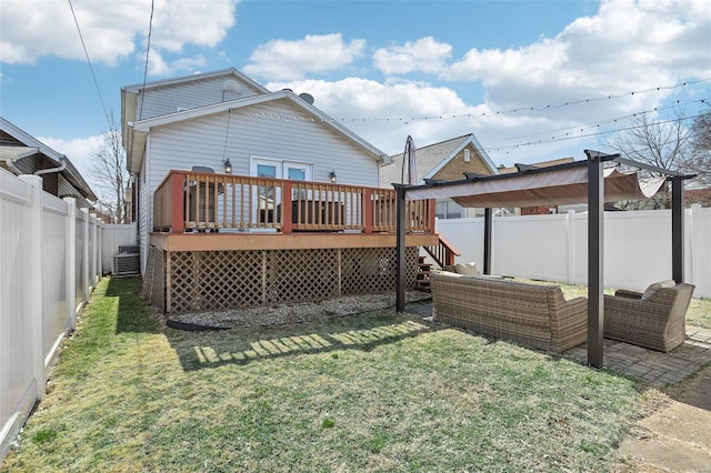 back of house featuring a fenced backyard, a yard, outdoor lounge area, a wooden deck, and central AC unit