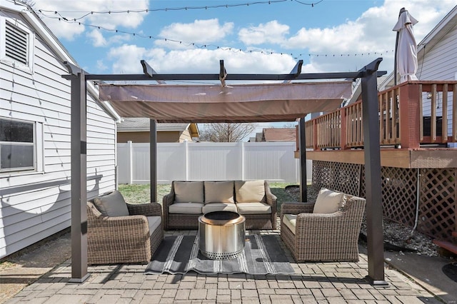 view of patio featuring an outdoor hangout area and fence