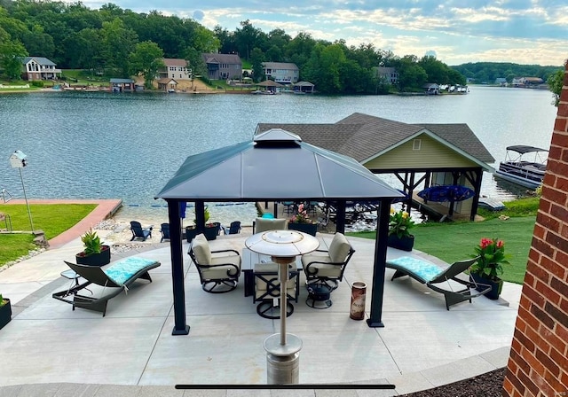 view of patio / terrace featuring a gazebo and a water view