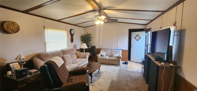 living room with crown molding, lofted ceiling with beams, and ceiling fan