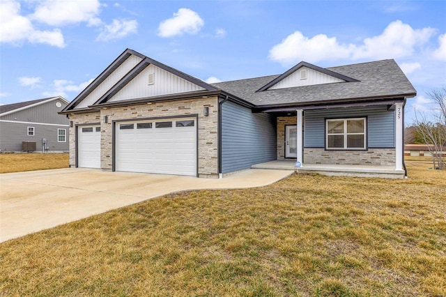 single story home featuring a garage, covered porch, and a front lawn