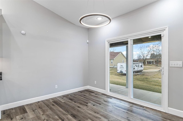 empty room featuring dark hardwood / wood-style floors