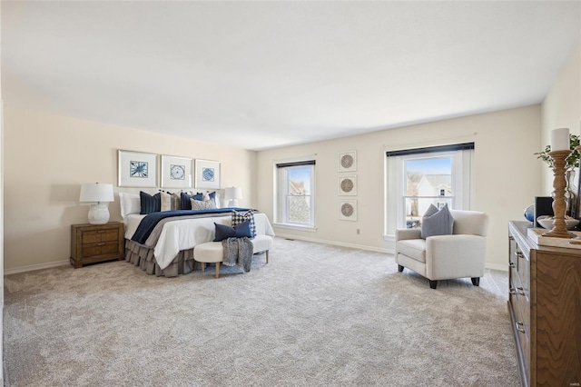 bedroom with baseboards and carpet floors