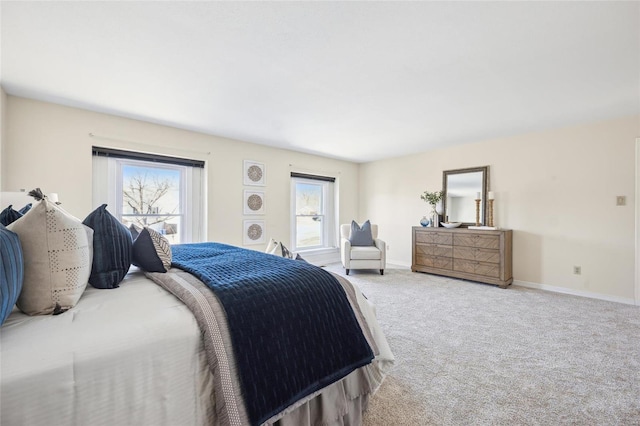 bedroom featuring carpet flooring and baseboards