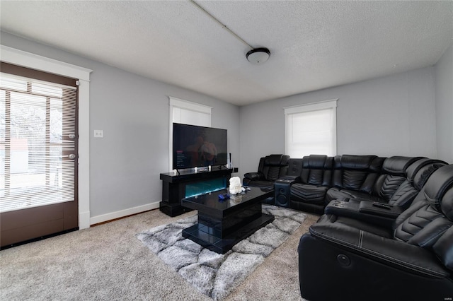 living area featuring a textured ceiling, baseboards, and light colored carpet